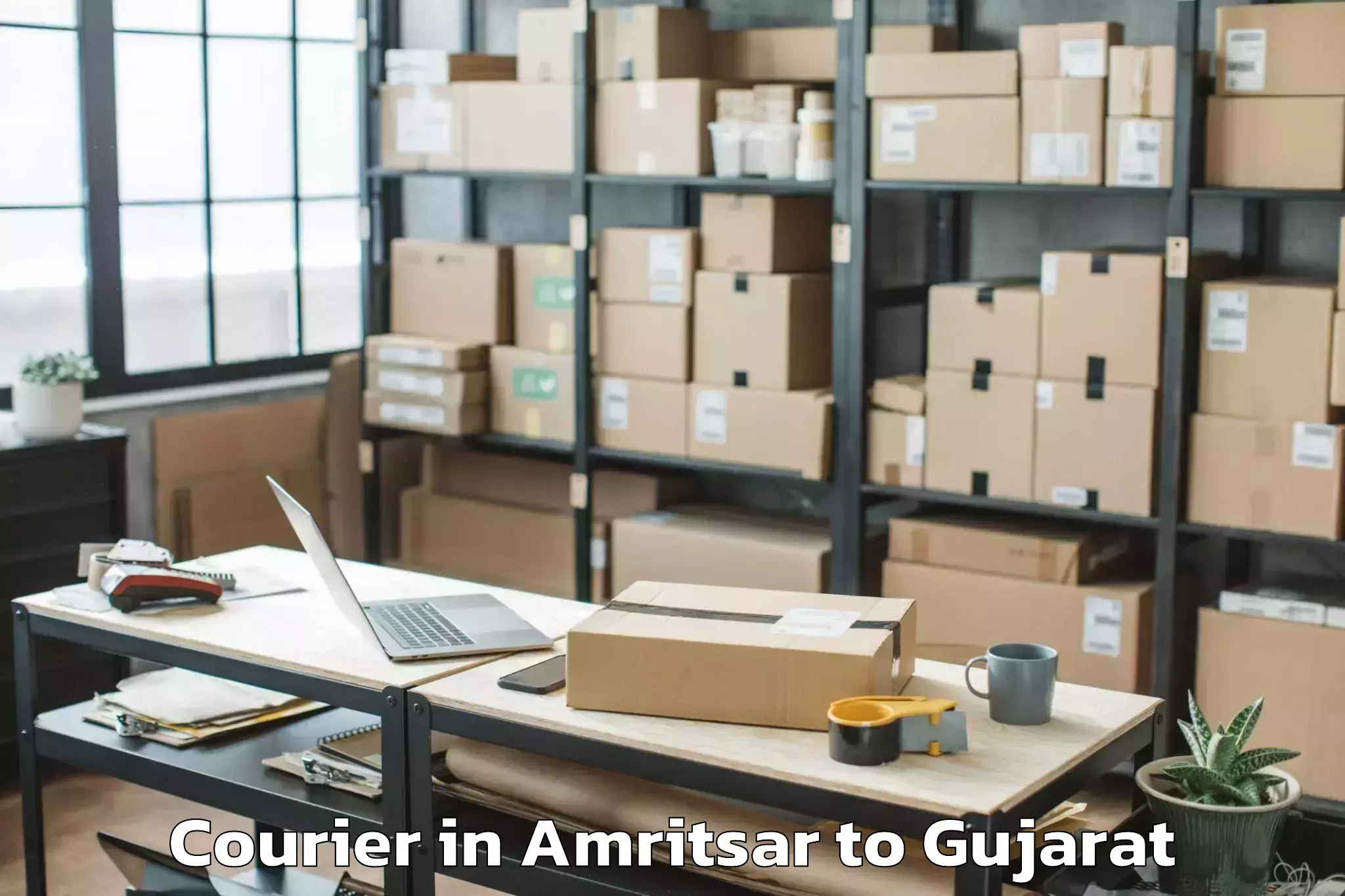 Book Amritsar to Gujarat University Of Transpla Courier